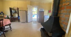 sítio em condomínio fechado com casa de costaneira duplada