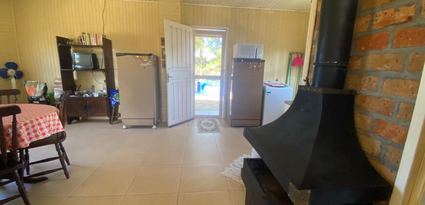 sítio em condomínio fechado com casa de costaneira duplada