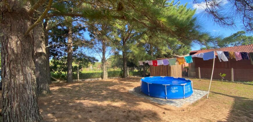 sítio em condomínio fechado com casa de costaneira duplada