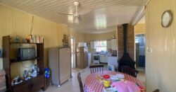 sítio em condomínio fechado com casa de costaneira duplada