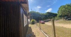 sítio em condomínio fechado com casa de costaneira duplada